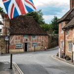 Typical English Village street with cottage style terraced housing and a Union Jack Flag